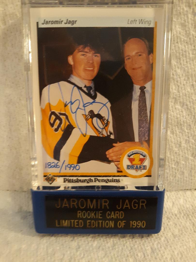 Hockey trading card of Jaromir Jagr with a blue holder on a textured surface
